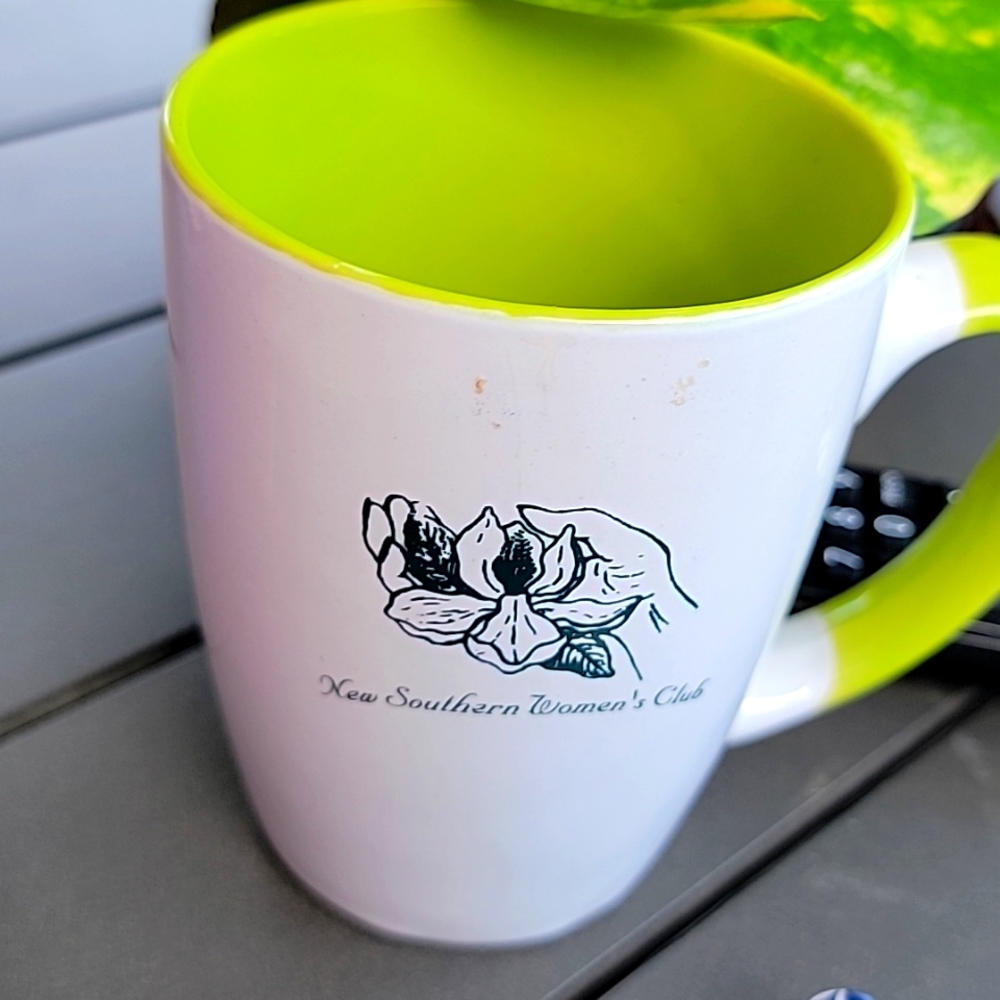 Green and white coffee cup.